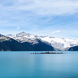 Lake with snowy mountains on the horizon