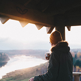 Person contemplating the landscape through a viewpoint