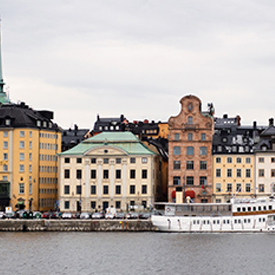 Buildings of different colors facing the river