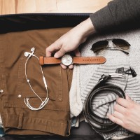 Girl waiting for a suitcase