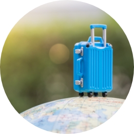 Blue suitcase on earth globe